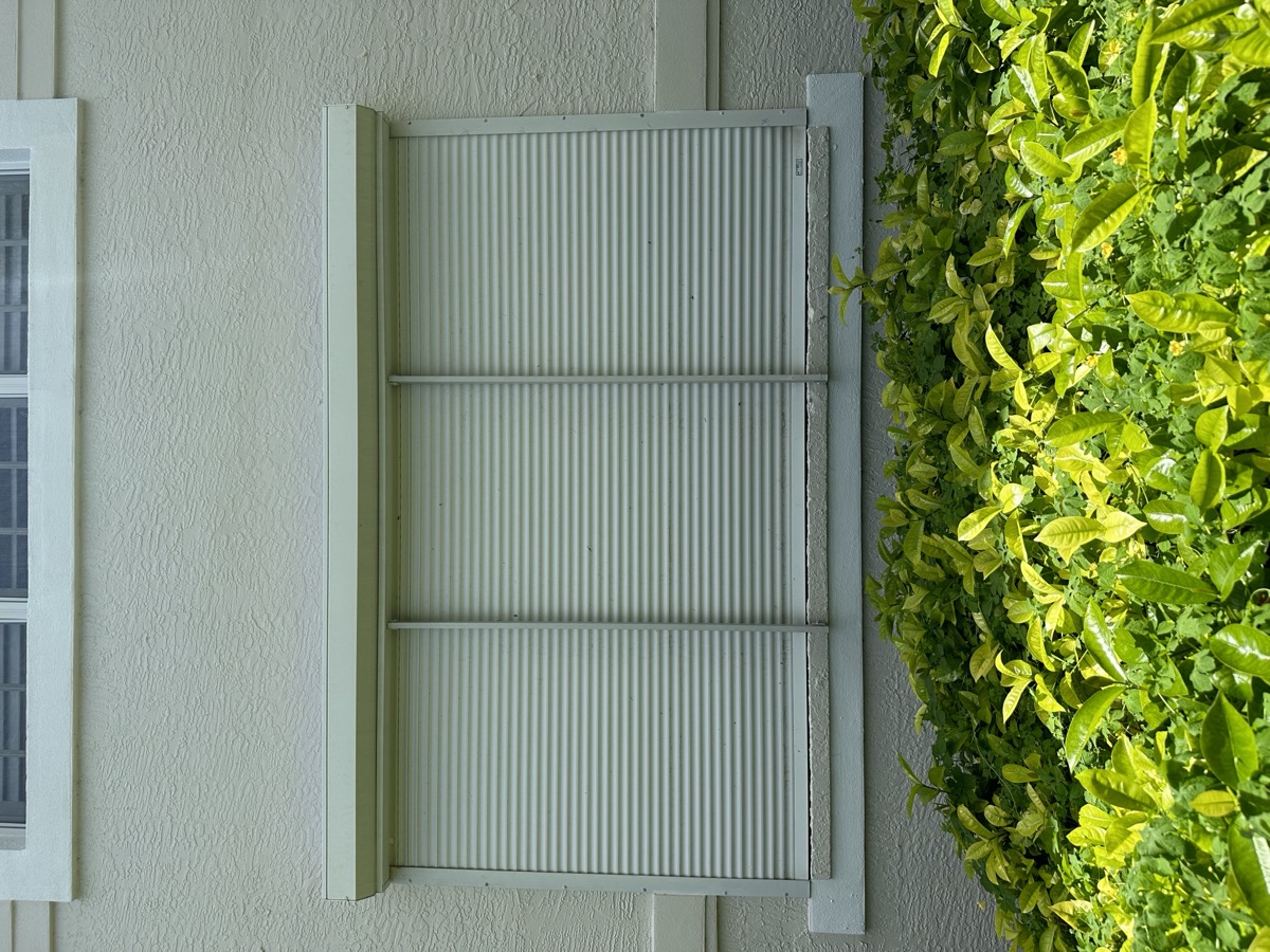 Storm panel shutter installed on window SWFL